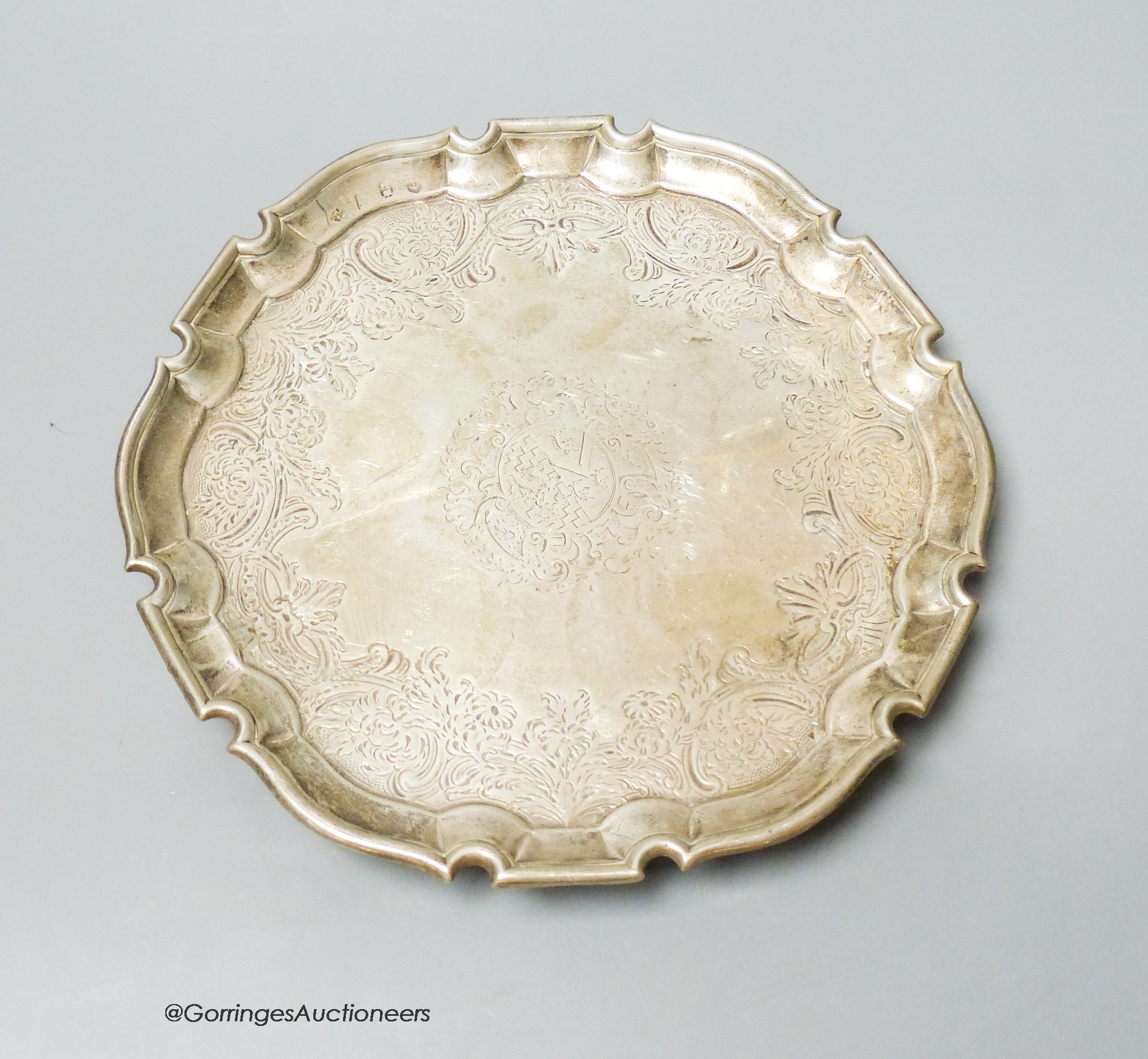 An early 18th century later engraved silver salver, marks rubbed, 23.7cm, 17oz.